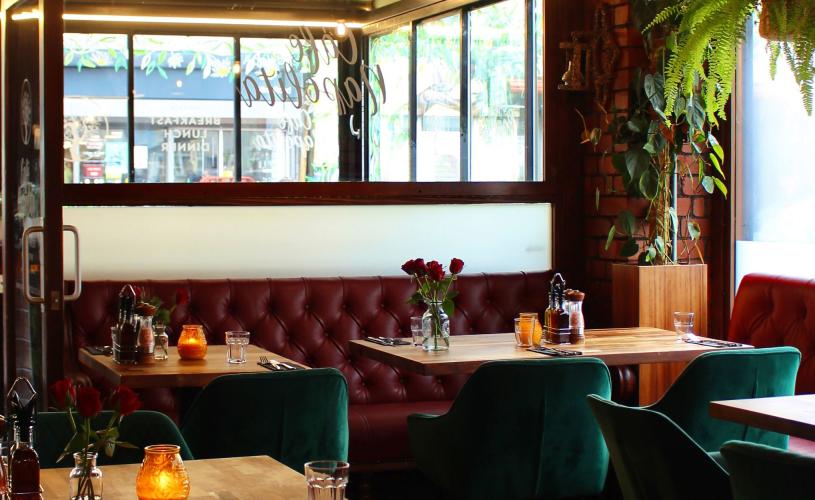 Interior of cafe with red leather booth seating - credit Cafe Napolita