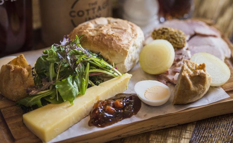 Ploughmans lunch at The Cottage Inn, Bristol with cheese, roll, pickle and pork pie - credit The Cottage Inn / Butcombe