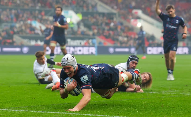 A rugby player diving to the try line