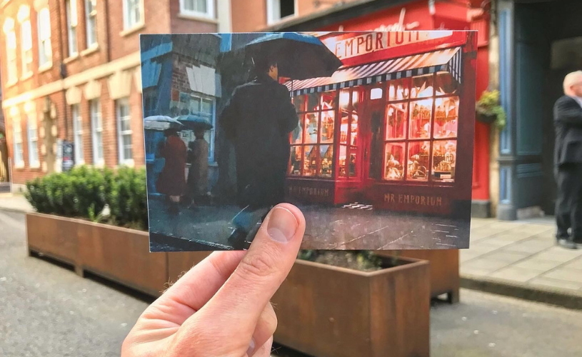 A view of Chez Marcel in Bristol's Old City, with a hand holding a photograph of an actor filming one of the 2023 Doctor Who specials in the same spot - credit Logan Walker