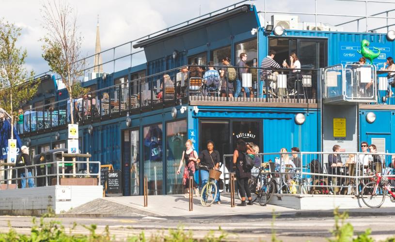 People dining alfresco at Wapping Wharf on Bristol's Harbourside - credit Jon Craig