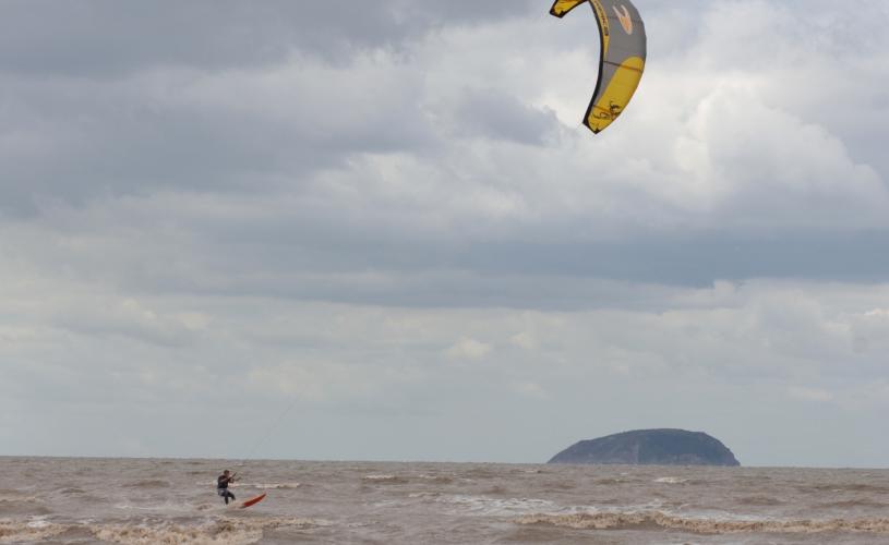 A view of a windsurfer in the sea at Weston-super-Mare near Bristol