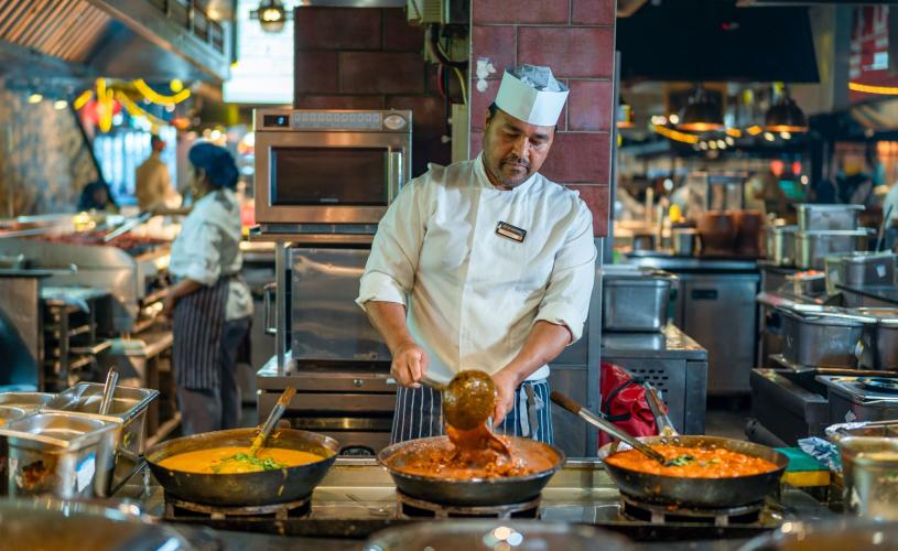 Indian stall at Za Za Bazaar. Indian chef cooking up halal dishes during a demo.