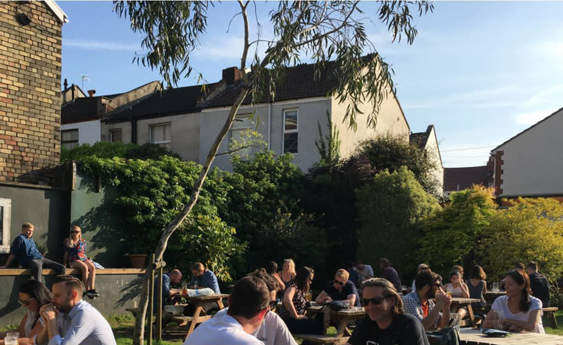 People sat in a beer garden - Credit Spotted Cow