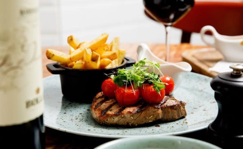 Steak and chips on plate