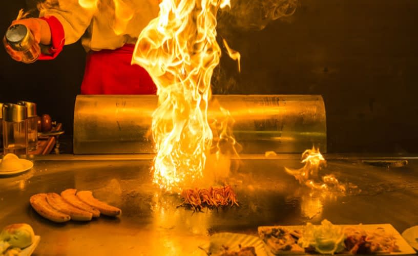 Food being cooked with flames