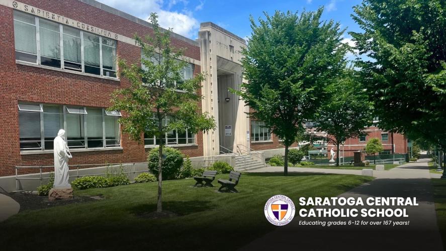 Exterior shot of brick school with logo in the lower righthand corner