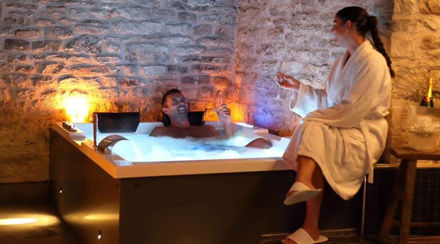 Couple enjoying the jacuzzi at Kings Head Hotel