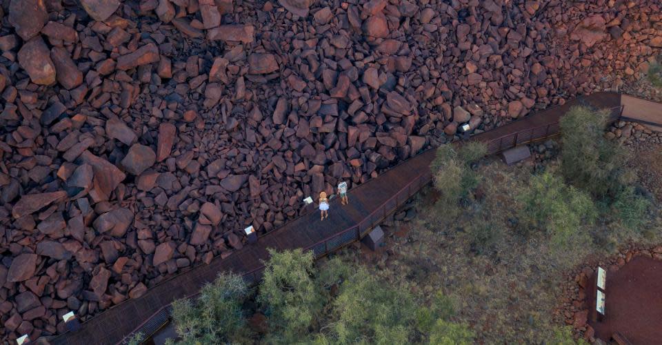 Aerial view of couple walking on Ngajarli Trail, Murujuga National Park