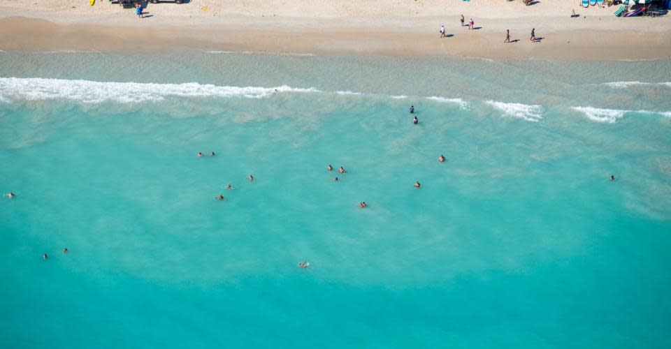 Aerial view of people enjoying Cable Beach Broome.