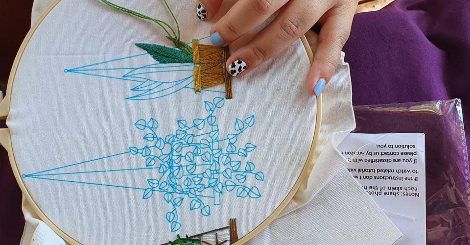 Cross Stitching at a Grateful Remnants Workshop