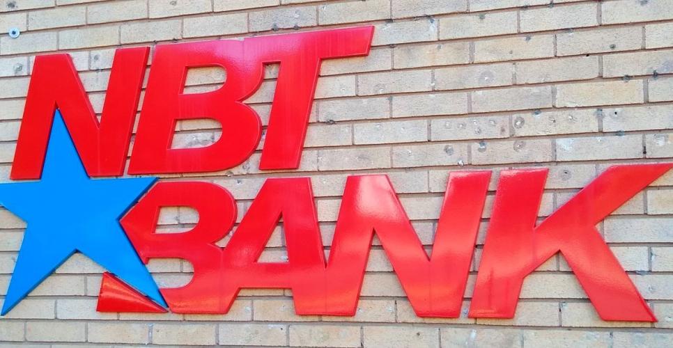 NBT Bank logo as sign on a brick building