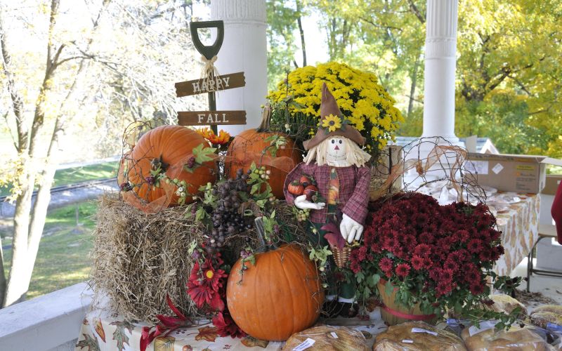 Handmade crafts and fall scarecrow displays at the River Ridge Craft Fair in Hanover, Illinois