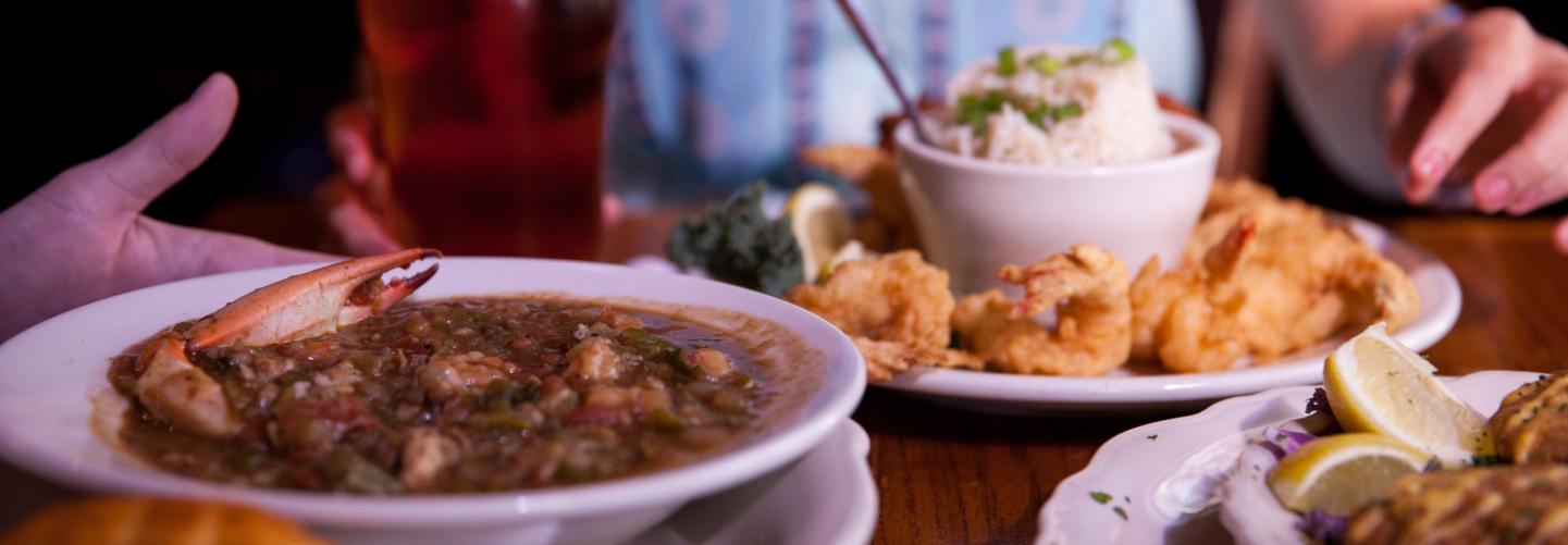 Tasty spread of gumbo, fish and shrimp dishes with local beer to wash it down