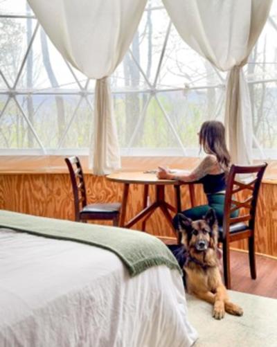 Tiffany Oden (gotlost.onpurpose) and her dog, Frek (trek.withfrek), in a dog friendly glamping dome at Airydale Retreat