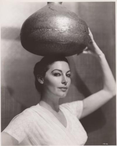 Ava Gardner holding water jug on head in character for Bhowani Junction
