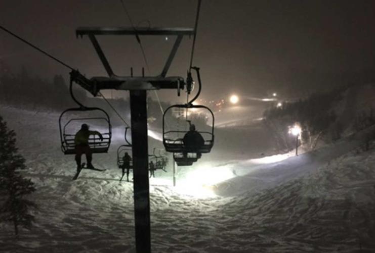 Night skiing at Utah Ski Resort. View of the ski lifts at a resort