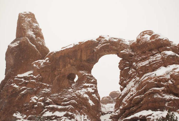 Turret Arch in Arches National Park Windows Section covered in snow