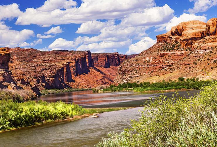 Colorado River with red rock and blue sky