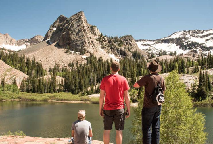 Hikers in front of Lake Blanche and Sundial Peak