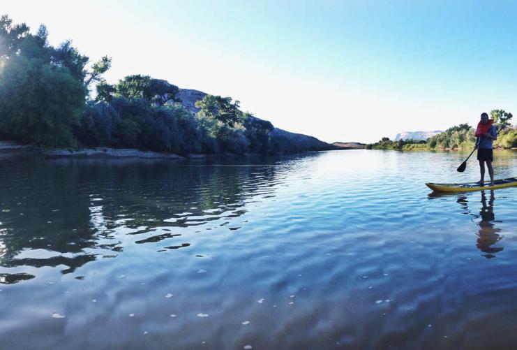 Person paddle boarding on the Green River