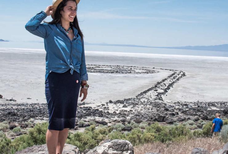 Woman standing in front of the Spiral Jetty at the Great Salt Lake