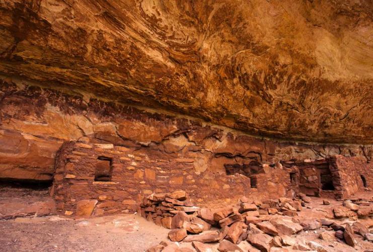 Native American ruins under a sandstone overhang