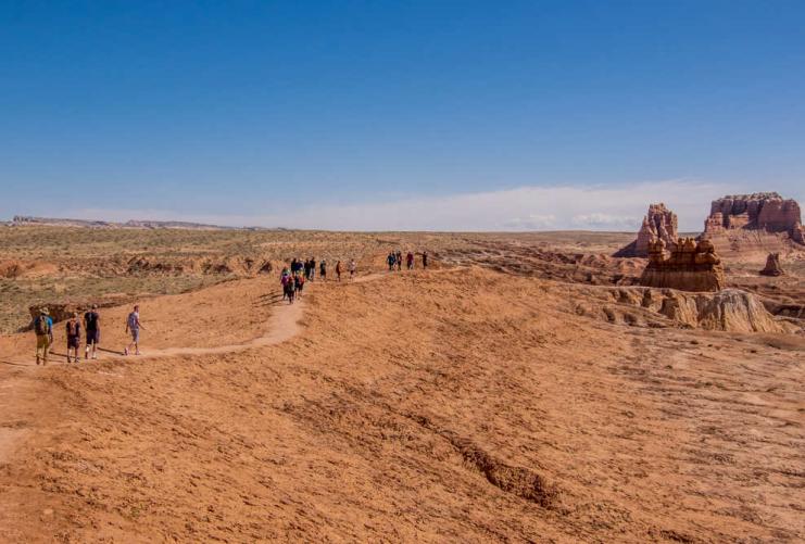 Group of people hiking in Goblin Valley State Park