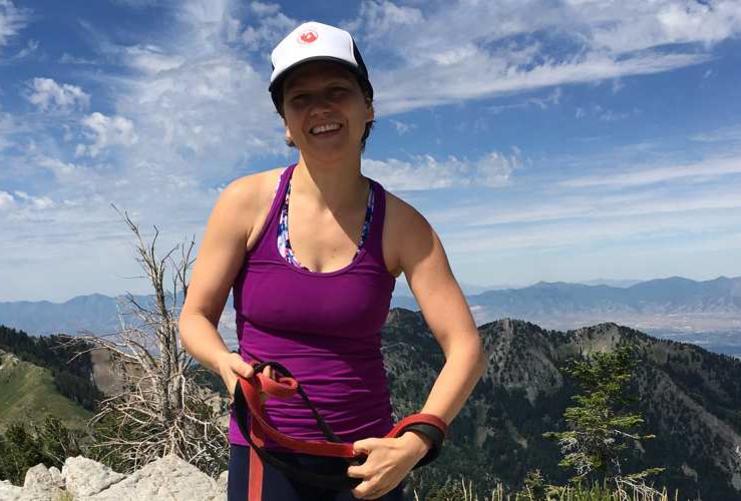 Female mountain climber on top of a mountain