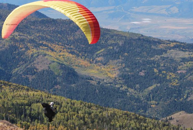 Paraglider above Utah mountains