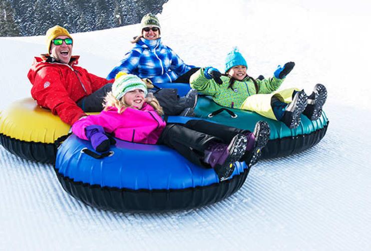 Family on tubes in Utah snow