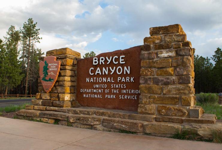 Bryce Canyon National Park sign with large stone pillars