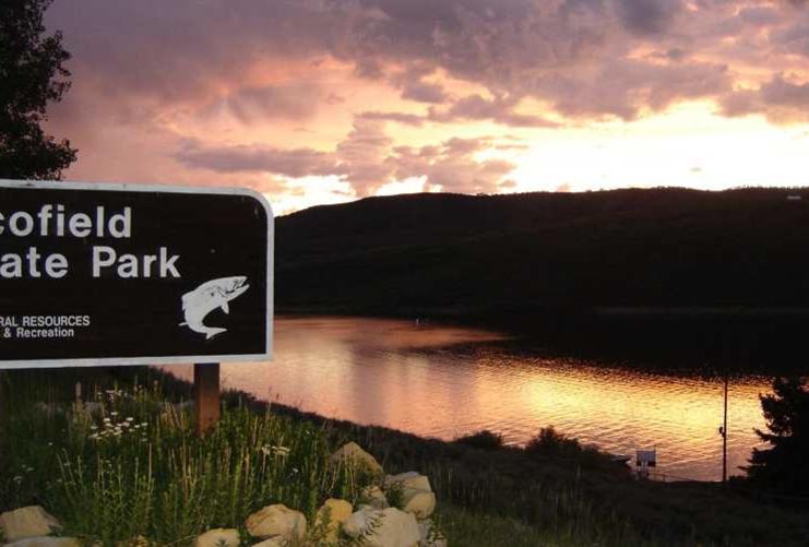 Scofield State Park sign at sunset