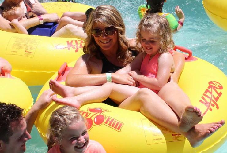 Families on floating tubes at Cherry Hill water park