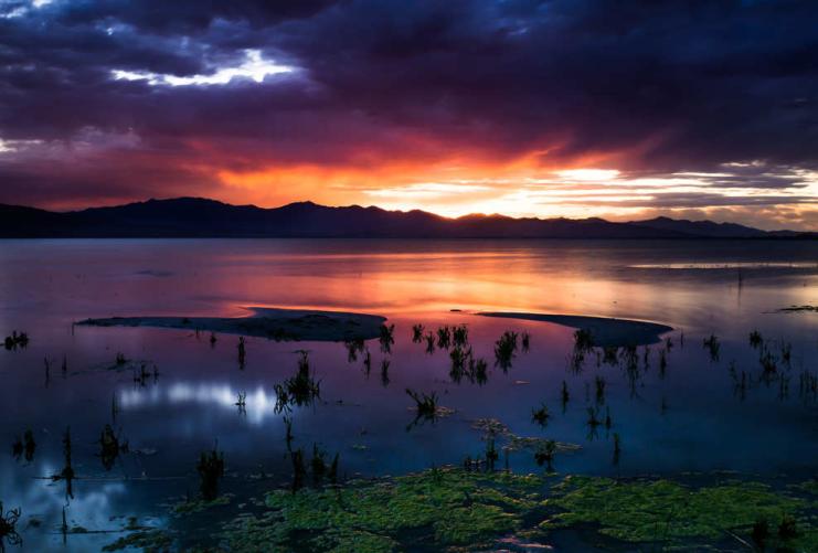 Sunset and reflection on the water at Utah Lake