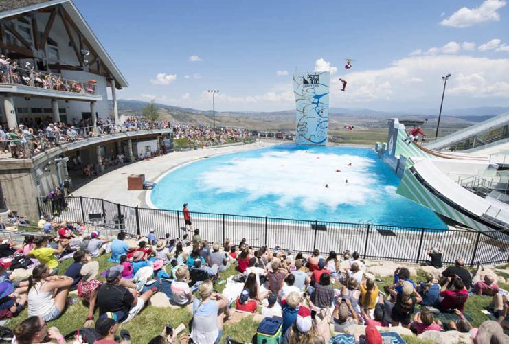 Skiers Jumping into Pool at Park City