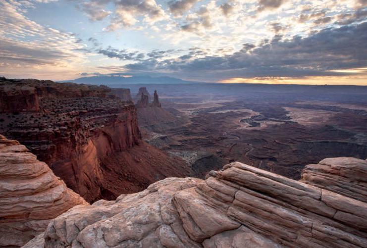 View of clouds and valley near Mesa Arch Utah