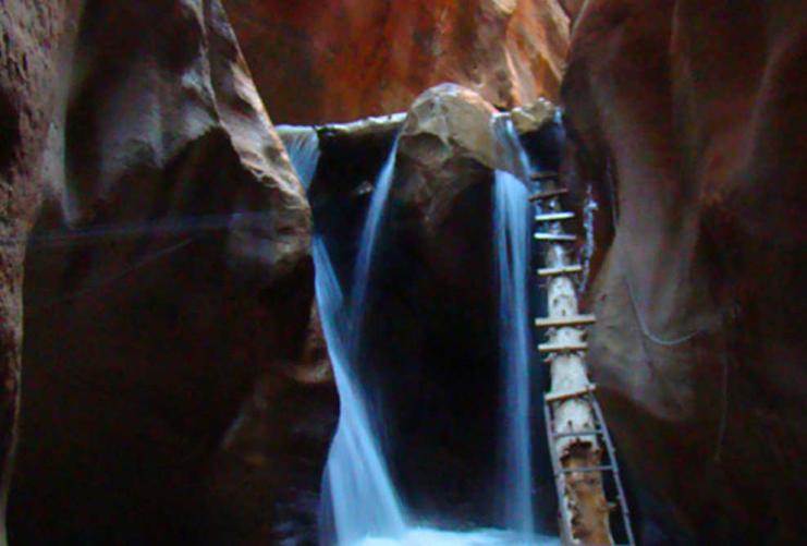 Ladder and waterfall at Kanarra Creek hiking trail