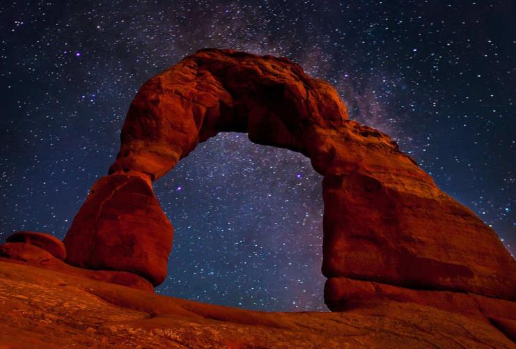 Star gazing through Delicate Arch at Arches National Park