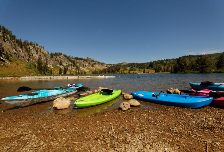 Several kayaks on the banks of Tony Grove Lake in Logan