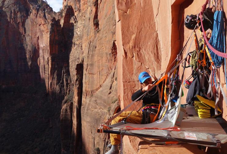 Rock Climber setting up a portaledge on Moonlight Buttress in Zion National Park