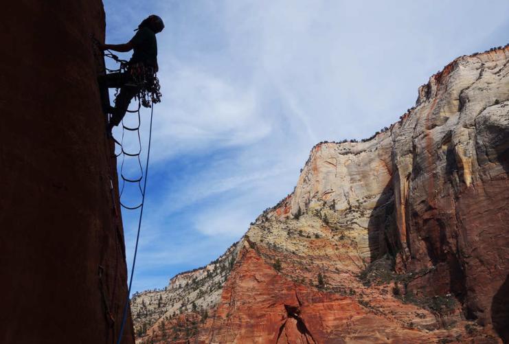 Climber silhouette in Moonlight Buttress in Zion National Park