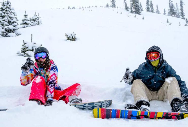 Couple snowboarding at Brian Head Ski Resort