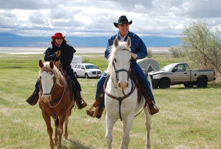 Couple riding on horseback in Utah