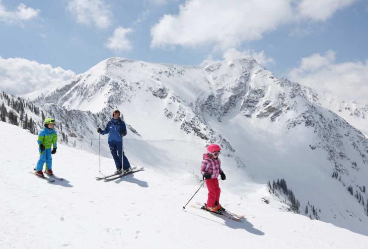 Family skiing on a sunny day