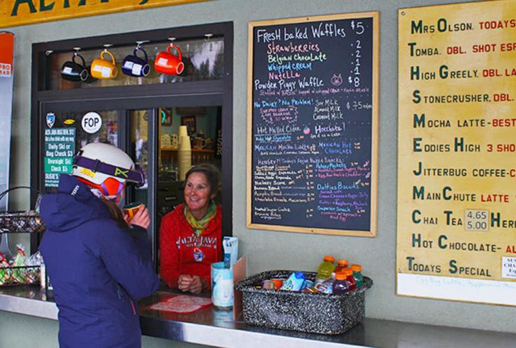 Skier ordering lunch at a ski resort