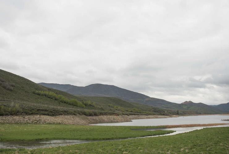 Green meadow and mountain lake in Northern Utah