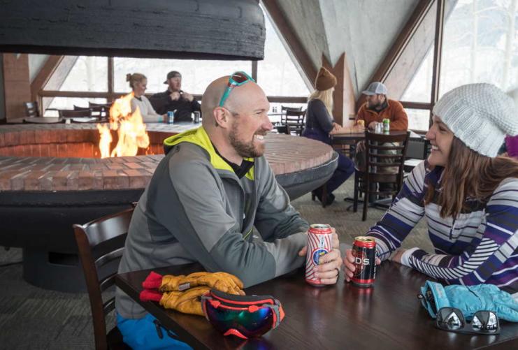 Couple eating lunch at a ski resort in Utah