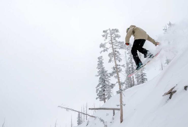 Snowboarder jumping at Brian Head