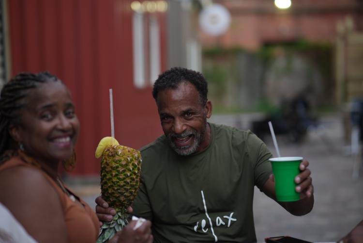 African American man and woman holding beverages